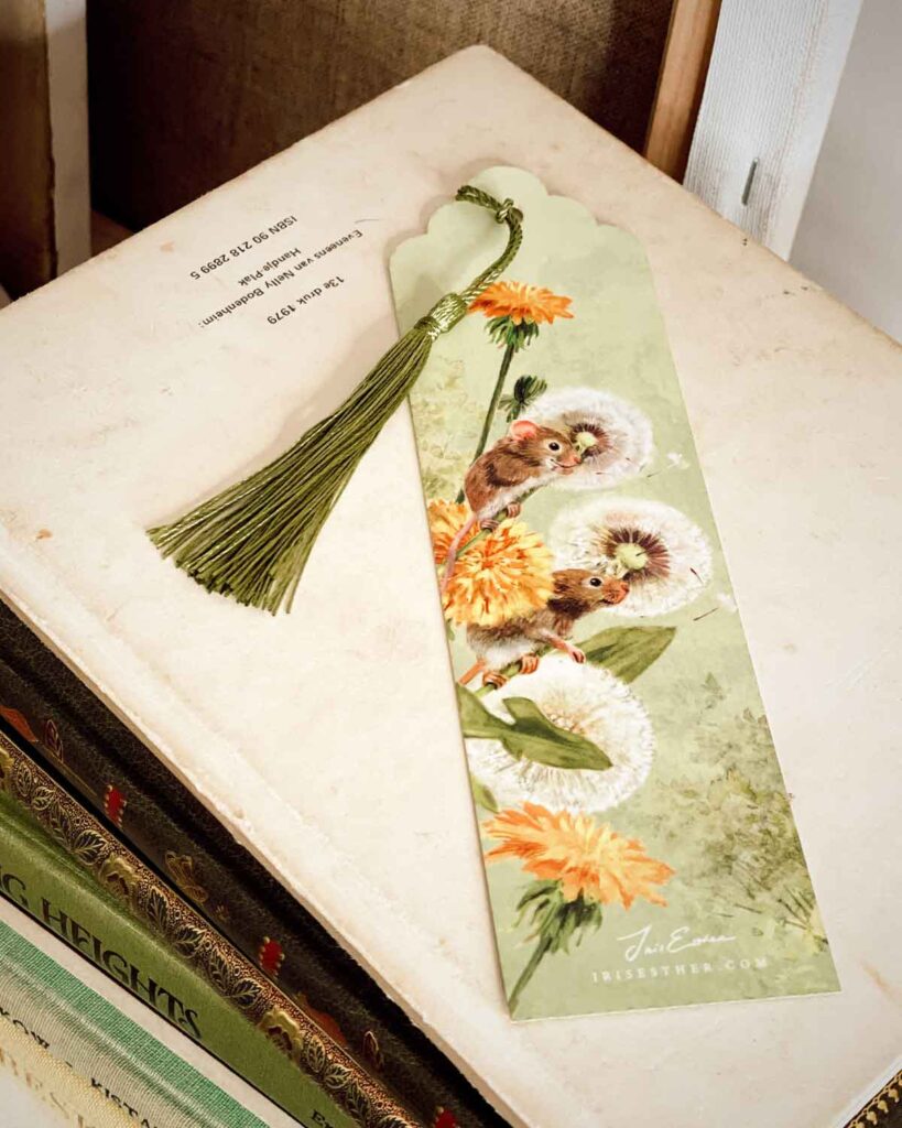 Whimsical mouse and dandelion art bookmark with scalloped top and hand-attached tassel, ideal for spring reading moments.
