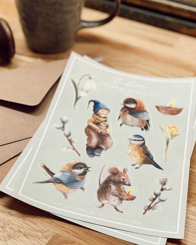 Art stickers featuring a forest mouse with a candle, early spring flora, and cozy birds—designed in a nostalgic, nature-loving style by Iris Esther.