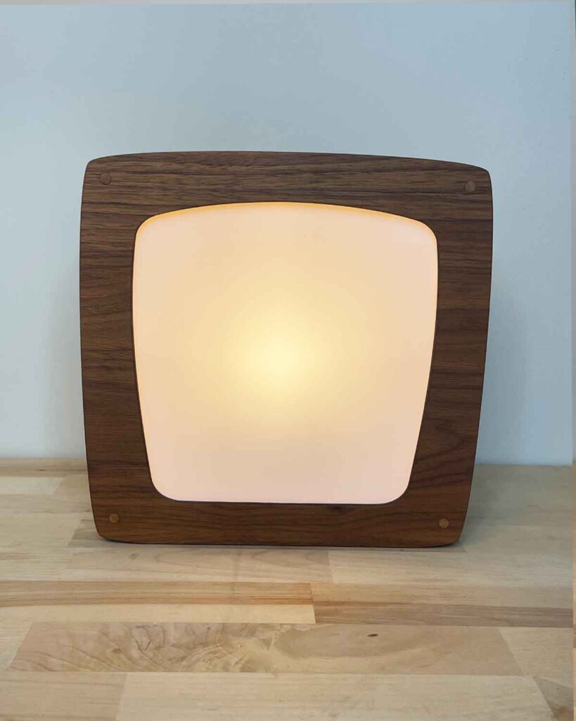 Seasons lamp creating a warm magical light with illustrated interchangeable panels