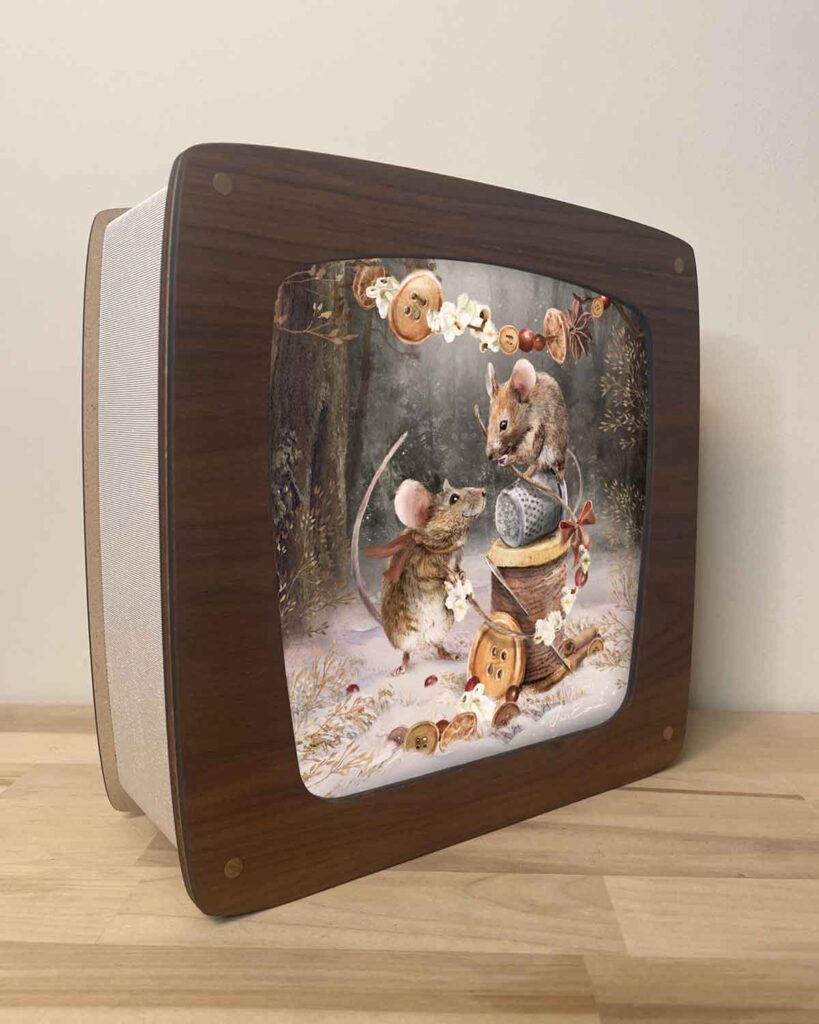 Decorative seasons lamp with walnut veneer front and glowing art panel with two mice celebrating christmas by decorting the woods
