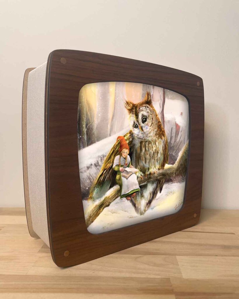 Seasons lamp creating a cozy seasonal glow with illustrated insert of a gnome girl reading to an owl in a winter wonderland by iris esther