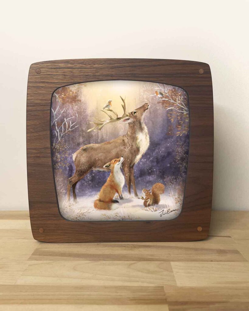 Walnut veneer lamp designed as a magical light seasons lamp with an illustration of animals in a winter wonderland