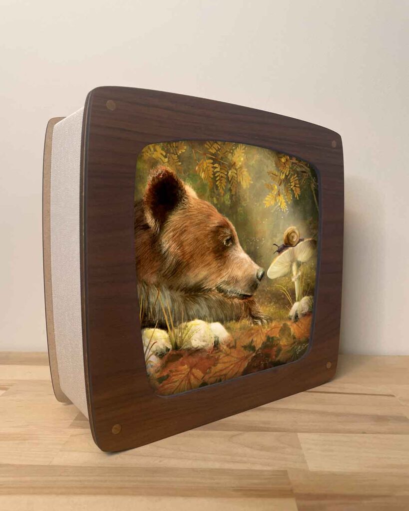 Waldorf walnut wood seasons lamp offering warm magical light and seasonal art of a bear and a snail on a mushroom