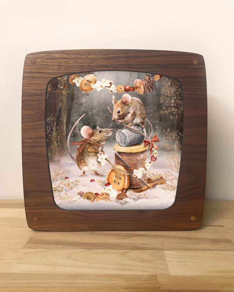 Seasons lamp designed to display art through warm magical light with a plate of two mice decorating woodlands for christmas